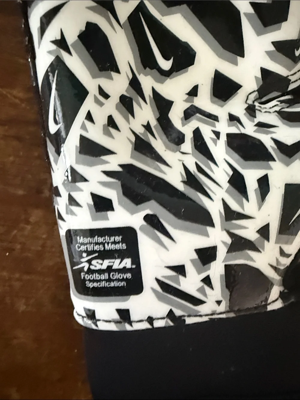 Nike Black Youth Shark Football Gloves with White Swoosh